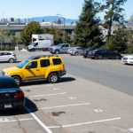Partial empty Lab parking lot showing spaces marked with blue triangles