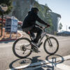 Person riding bike uphill near Berkeley Lab guest house